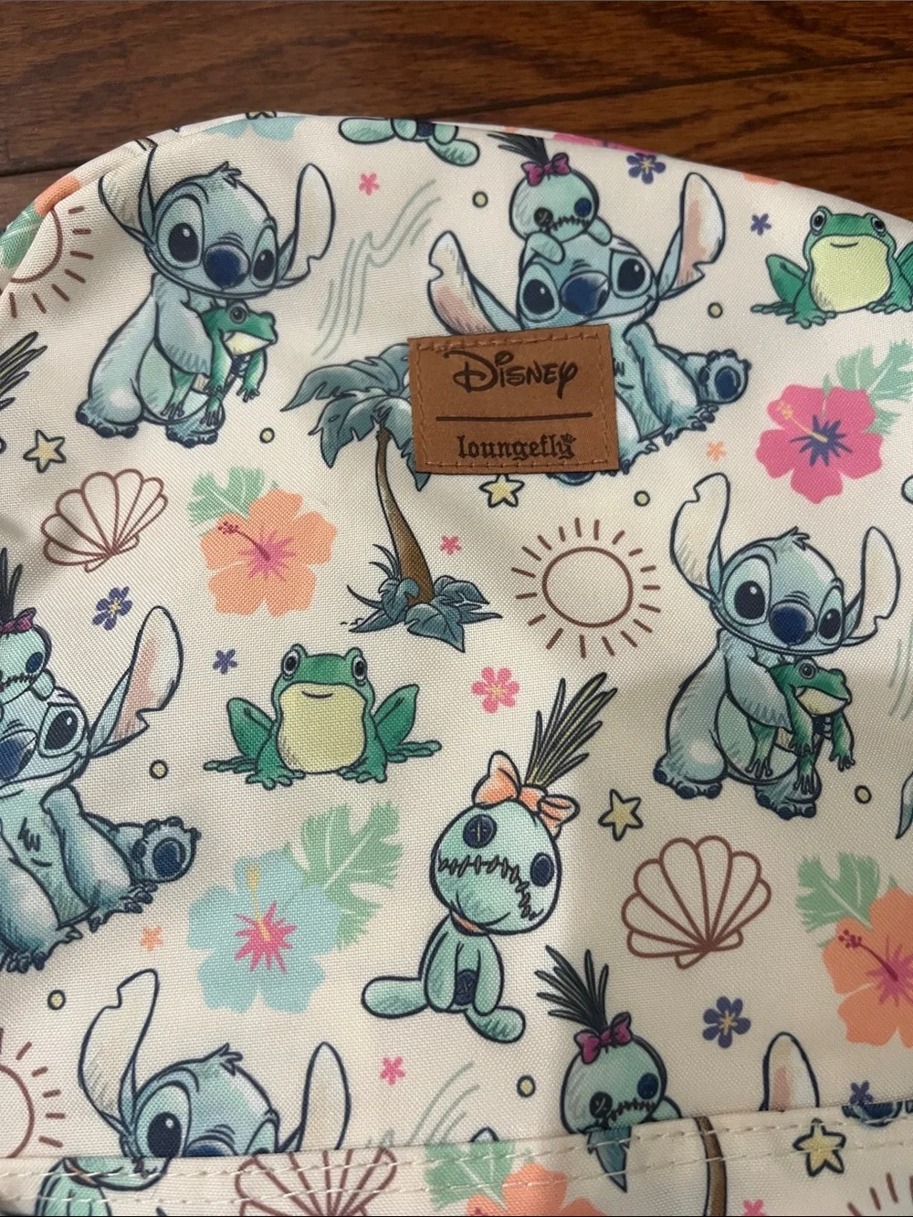 Disney Loungefly Cream Backpack with Aqua Stitch & Green Frog Print